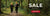 An advertisement featuring two people running in a forest, with the text "SALE ON SELECTED ITEMS SHOP NOW" displayed.


